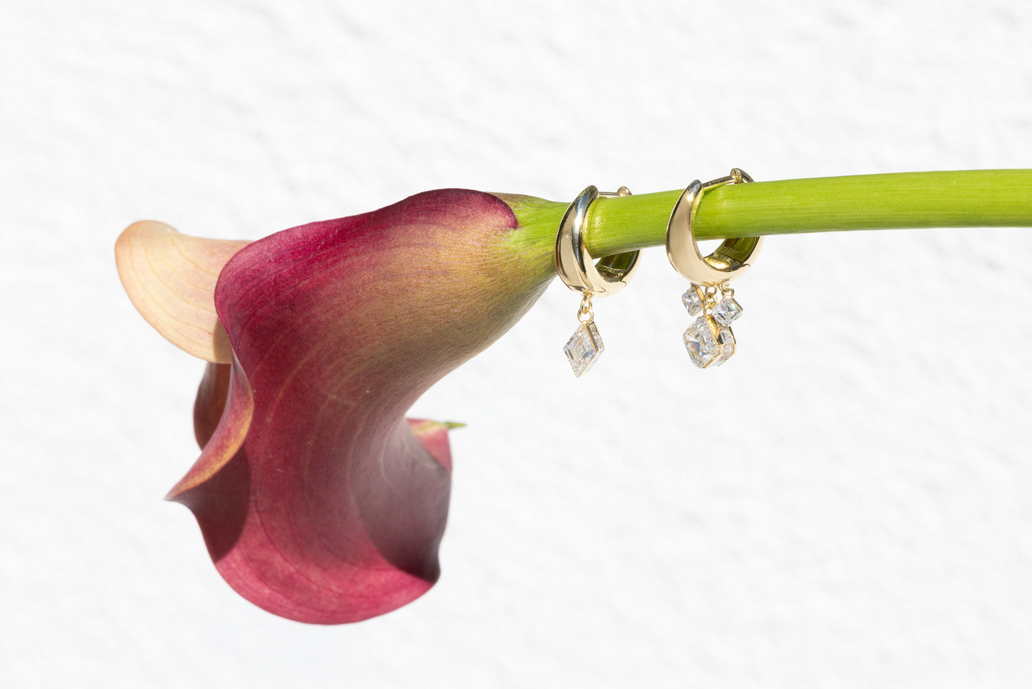 cala lily with 2 hoop diamond dangles hanging on stem