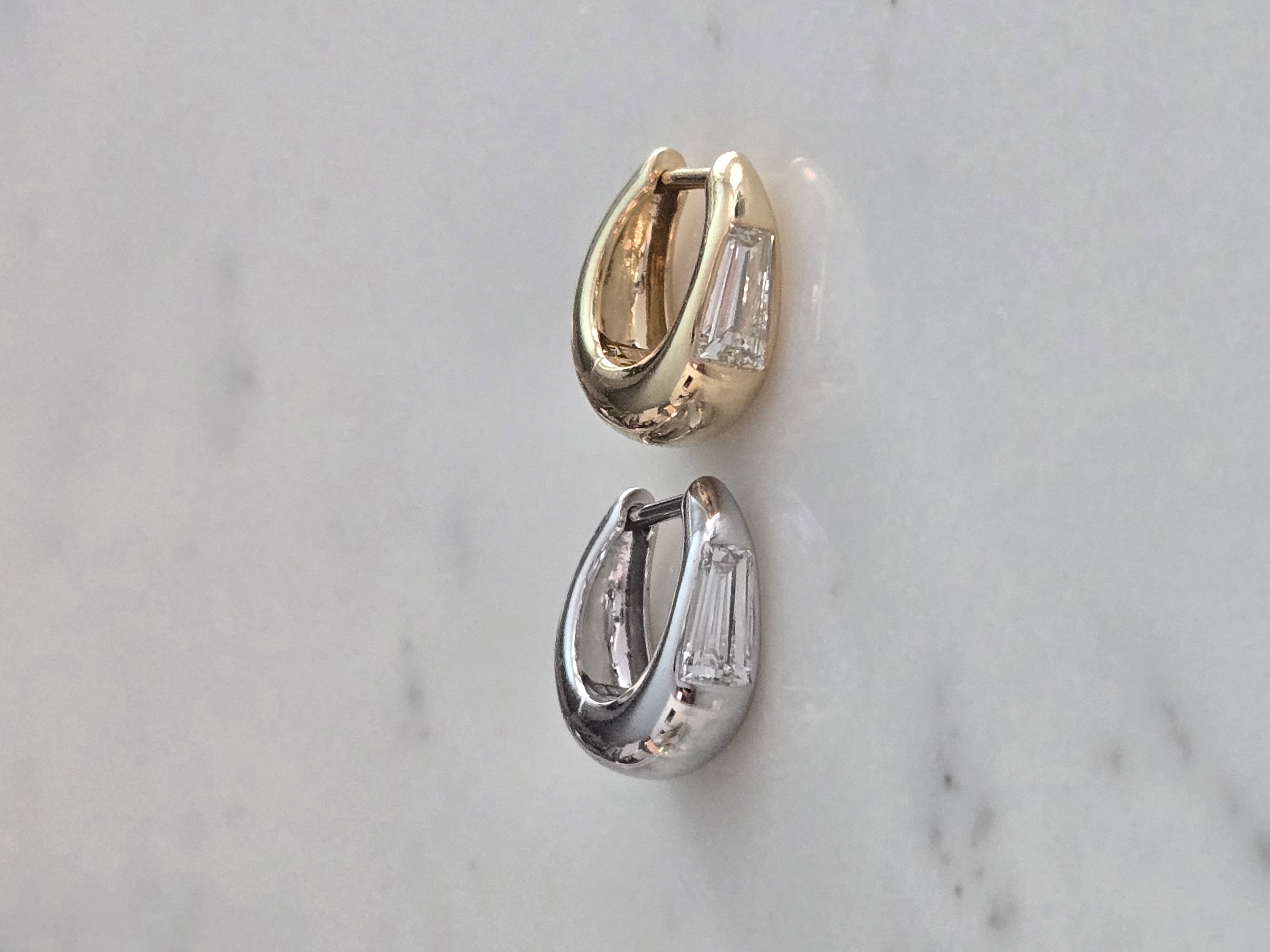 18k yellow gold and white gold 8mm signature tapered hoop with tapered baguette diamond center