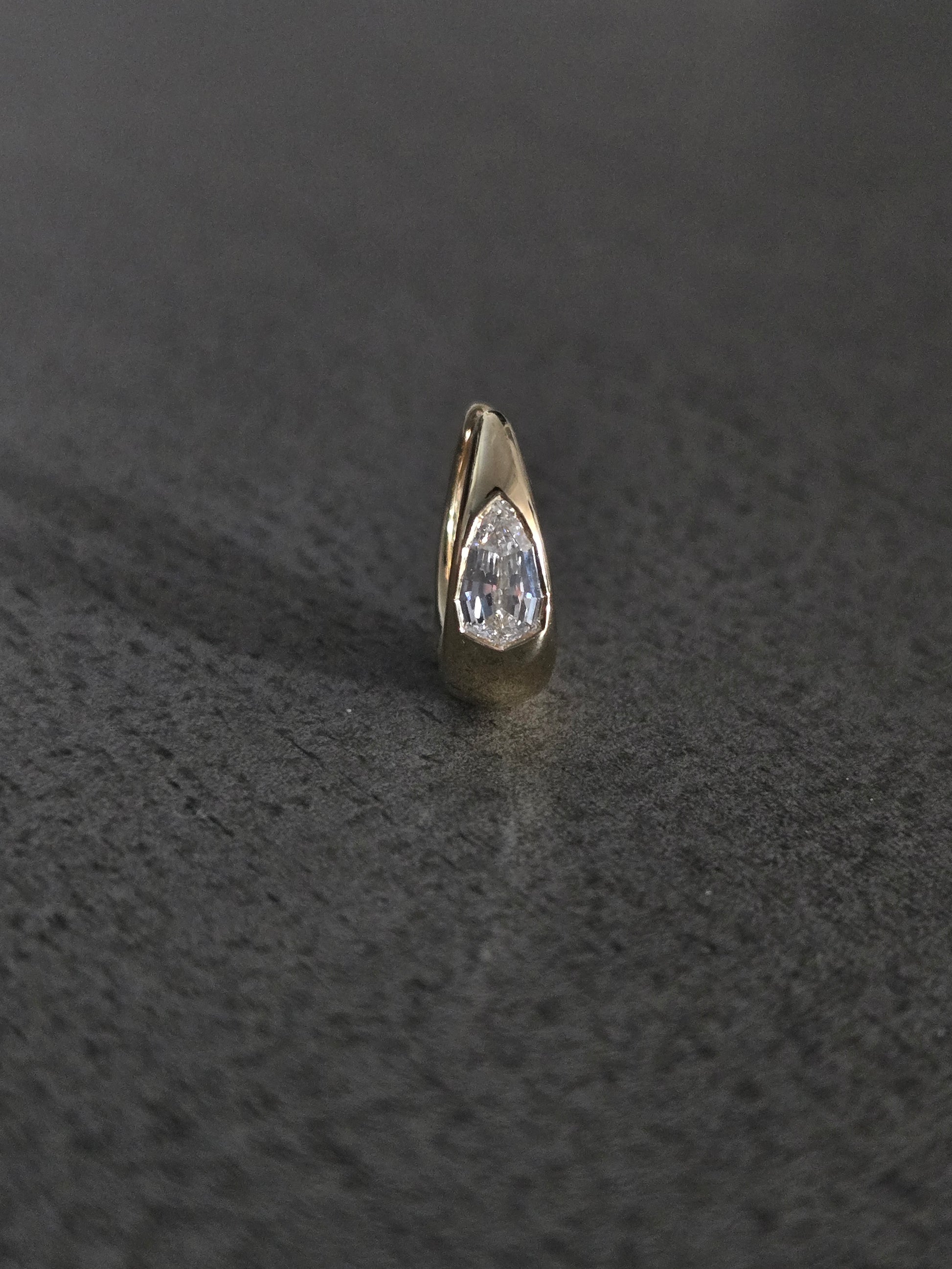 18k yellow gold 9.5mm signature tapered hoop with pear step-cut diamond center