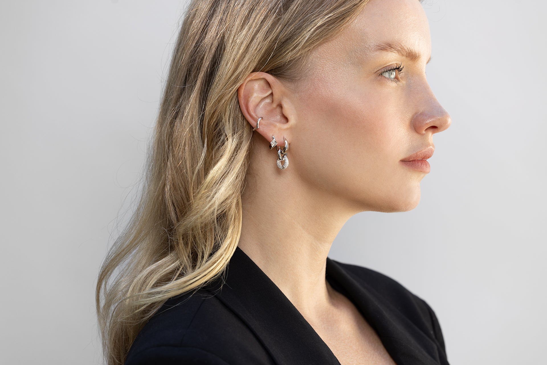 on model
: 18k white gold V shaped ear cuff, 18k white gold lozenge diamond Viv hoop, 18k  white gold 9.5mm signature tapered hoop connected to 18k white gold 6.5mm signature tapered hoop and 18k white gold 8mm encrusted diamond hoop